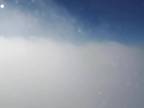 V oblakoch (pohľad z lietadla)