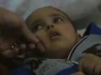 Dieťa vyslobodené z ruín budovy zbombardovanej Izraelom (DRSNÉ)