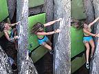 Chlapi asistujú žene, ktorá predvádza svoje lezecké schopnosti na skale