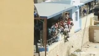 Migranti a Talianska polícia